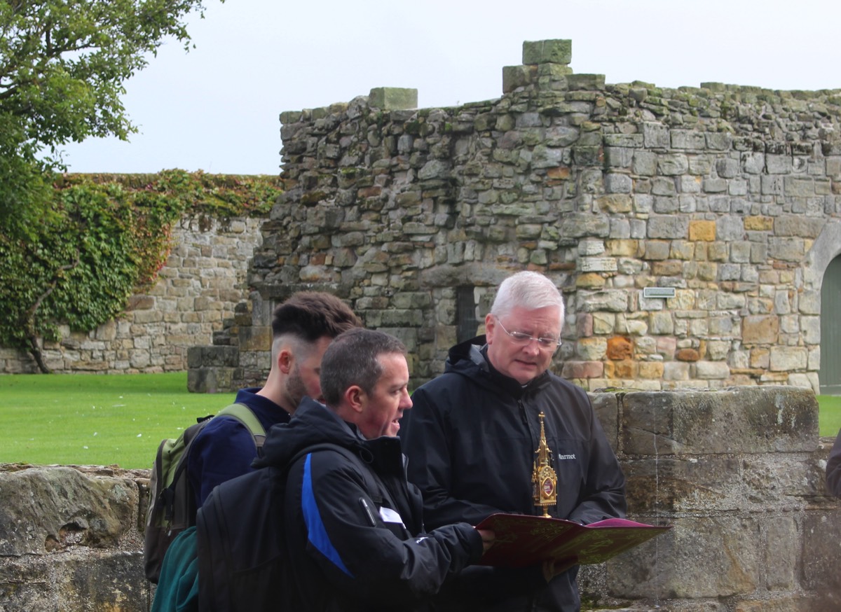 Archbishop Cushley venerating the relics of St Andrew on Cathedral grounds