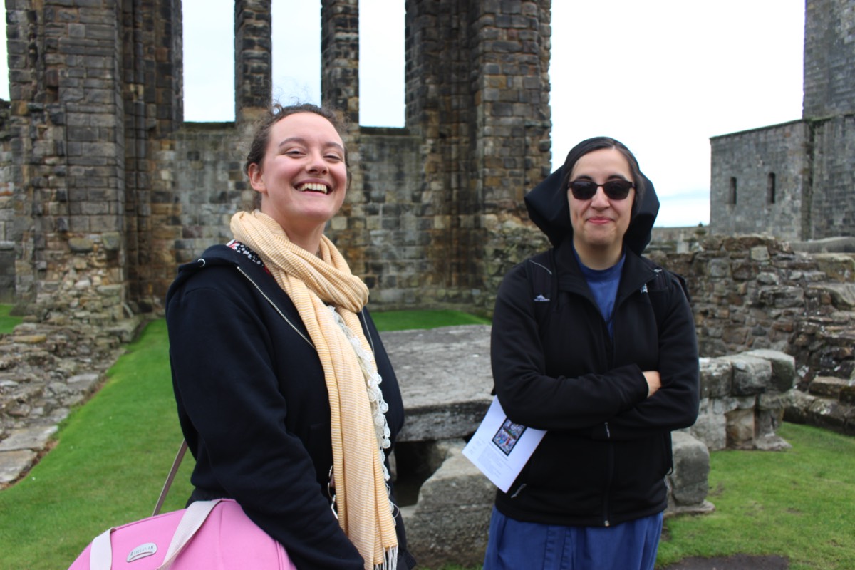 Young parishioner from Penicuik with a Sister from the USA at the altar of St Andrews Cathedral